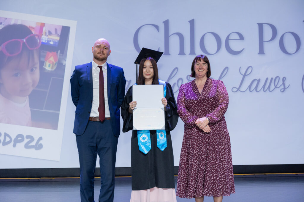 Nexus learner, Chloe on stage with the school Principal and Head of Secondaryduring the IBDP Graduation Ceremony at Nexus International School Malaysia.