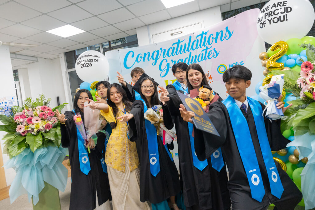 Nexus learner, Evelyn celebrates with fellow IBDP graduates after the graduation ceremony at Nexus International School Malaysia.